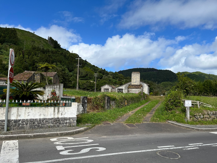 Scenic photo of a bright blue sky over top of green lucious hills
